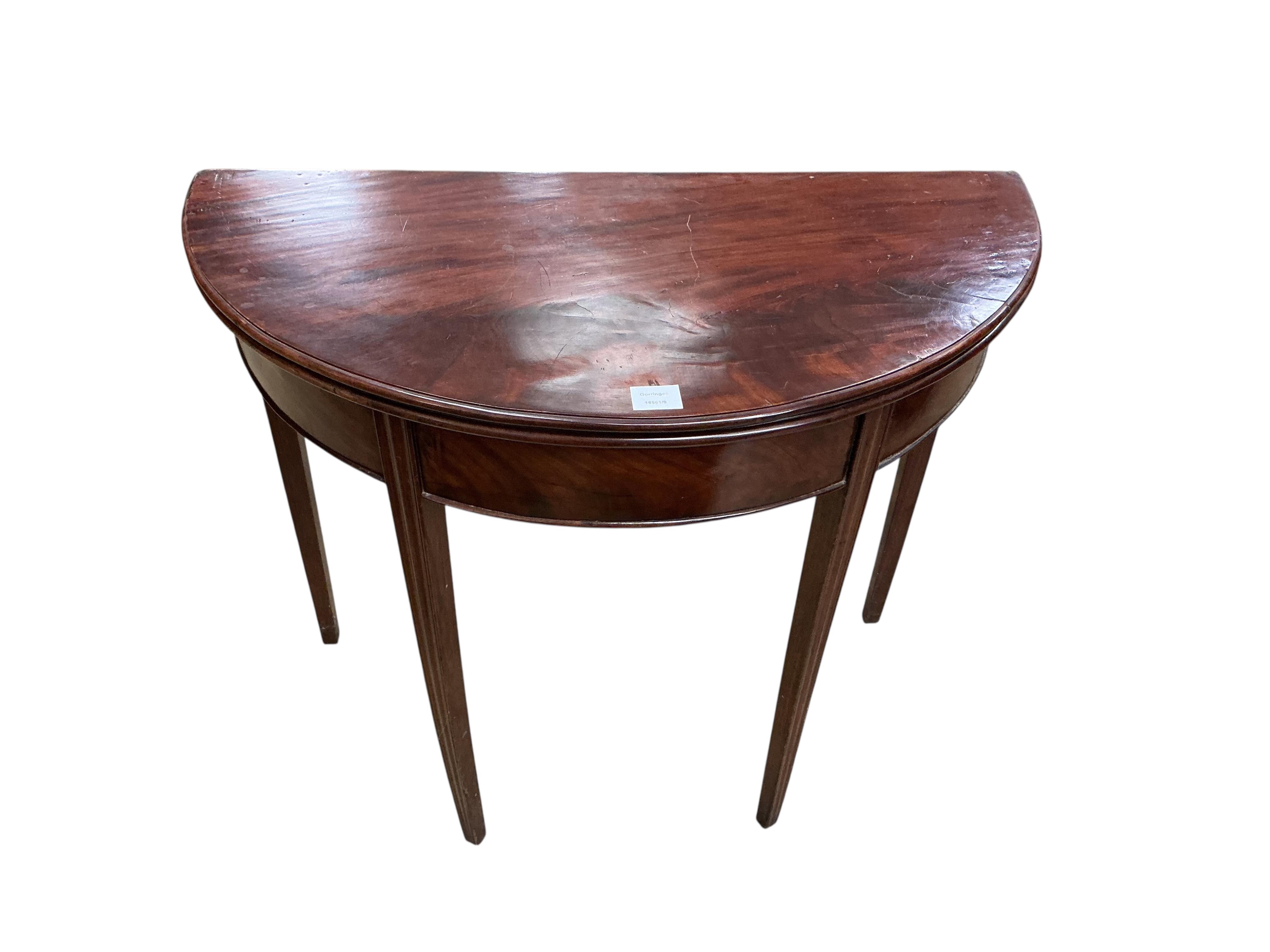 A George III mahogany 'D' shaped folding tea table, width 90cm, depth 44cm, height 72cm
